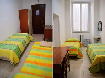 a room with three beds with yellow and green blankets at Ostello Marello in Rome