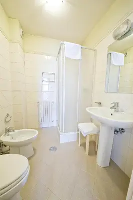 a bathroom with a sink and a toilet and a shower at Gästehaus Deutscher Orden in Rome
