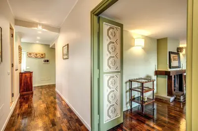 an empty hallway with a door in a house at Roof top dream piazza del popolo in Rome