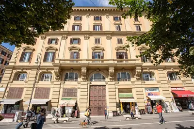 a large building with people walking in front of it at Roof top dream piazza del popolo in Rome