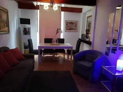 a living room with a table and a couch at Coronari 45 apartment in Rome