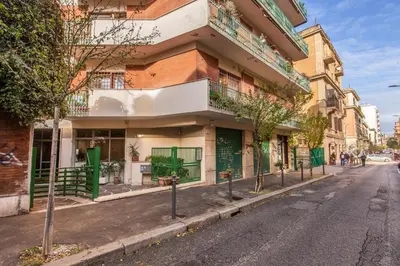 an empty street in front of a building at M&L Apartment - Ardesia Terrace in Rome