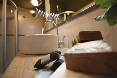 a kitchen counter with a sink and a cup on it at Boschetto Monti Apartment in Rome