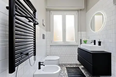a white bathroom with a sink and a toilet at My Little Holiday in Rome