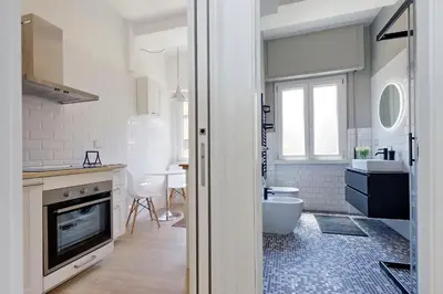 a kitchen with a sink and a toilet in a room at My Little Holiday in Rome