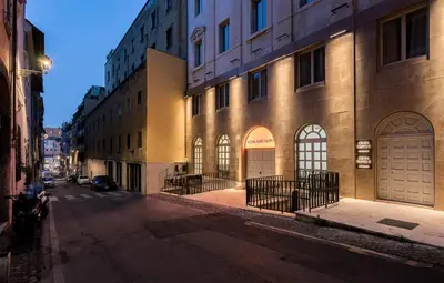 an empty street in a city with buildings at Room Mate Collection Filippo, Rome-Fontana di Trevi in Rome