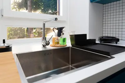a kitchen with a stainless steel kitchen sink at Donatello Loft in Rome