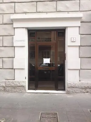 a door to a building with a sign in it at Nannarè Guest House in Rome