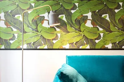 a wall with a mural of green bananas at TrastevereHome - Central Monserrato House with Balcony in Rome