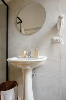 a bathroom with a sink and a mirror at Da Fede in Rome