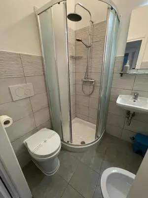 a bathroom with a shower and a toilet and a sink at Trastevere & Gianicolo Sweet Rest in Rome
