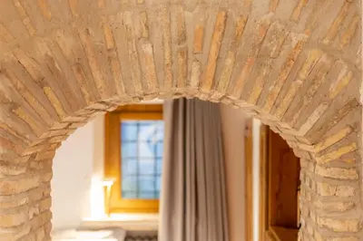 a bedroom with a bed with towels on it at Suite Italy Roma in Rome