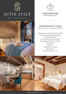 a bedroom with a bed with towels on it at Suite Italy Roma in Rome