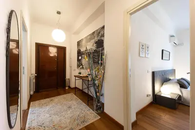 a hallway with a vase of flowers in a room at Mirabella Apartment in Rome