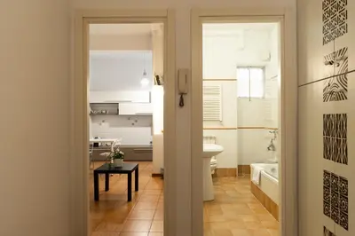 a bathroom with a toilet and a sink at Mirabella Apartment in Rome