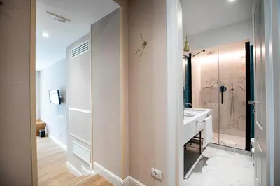 a bathroom with a sink and a shower at Vicario Suites in Rome
