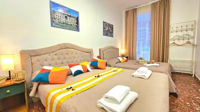 a bedroom with two beds with towels on them at A Casa Simpatia in Rome