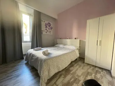 a small bedroom with a bed and a window at Moshi Moshi in Rome