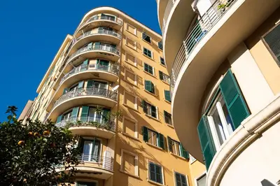 an apartment building with balconies and an orange tree at Appartamento 2 in centro a Roma in Rome