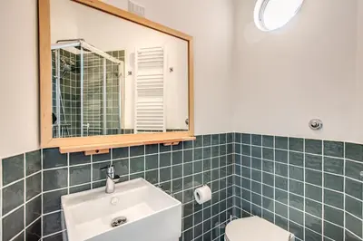 a bathroom with a sink and a mirror at Cavour Attic with terrace in Rome