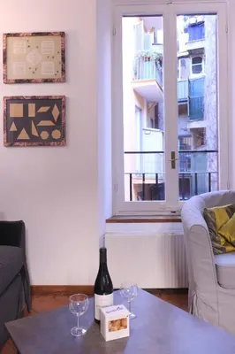 a living room with a table with wine glasses on it at Lovely Navona Apartment in Rome