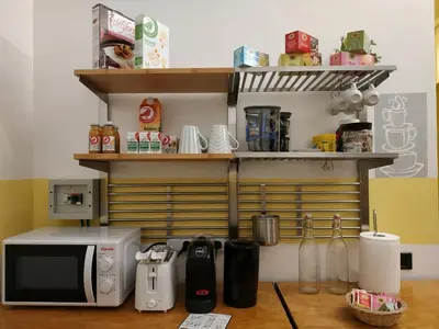a kitchen with a counter with a microwave and a microwave at B&B Claudia a Monteverde in Rome