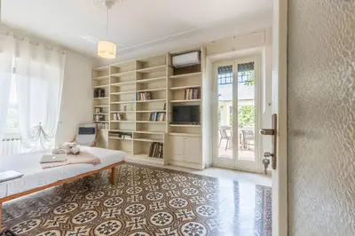 a room with a bed and a book shelf at Trastevere In Love in Rome