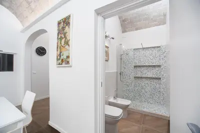a bathroom with a toilet and a shower at groundfloor wonderfull apartment in Rome