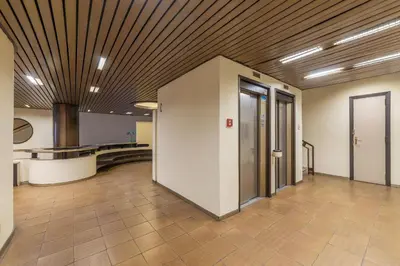 an empty lobby with a vaulted ceiling and a hallway at GuestHost - Sant'Angelo Modern Apartment in Rome