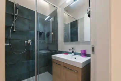 a bathroom with a sink and a shower at Roman Station House in Rome