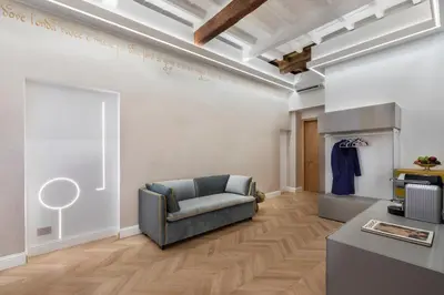 a living room with a couch and a table at Poēsis Experience Hotel in Rome