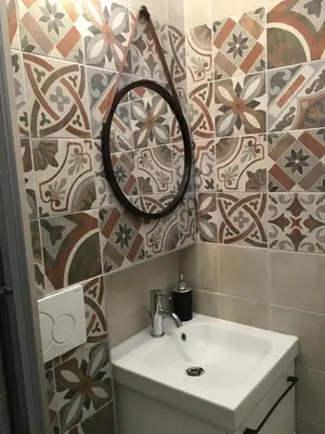 a bathroom with a sink and a mirror at LE FATE STUDIO a San Pietro in Rome