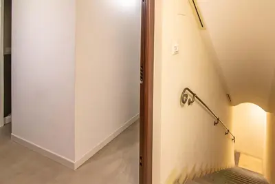 a room with a door and a wall with a pole at The Pantheon Eyes in Rome