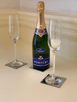 two wine glasses and a bottle of champagne at Simon's Guest House Rome in Rome