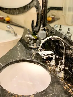 a bathroom counter with a sink and a white sink at Simon's Guest House Rome in Rome