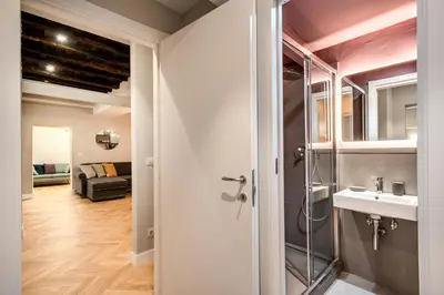 a bathroom with a shower and a sink in a room at Trevi Fountain Superior 3 bdr apartment in Rome