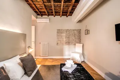a living room with a couch and a table at Trevi Fountain Superior 3 bdr apartment in Rome