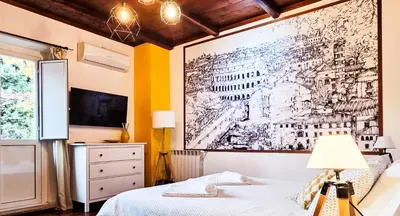 a bedroom with a drawing on the wall at Casa Flavia - Beauty apartment close to Vatican Museum in Rome