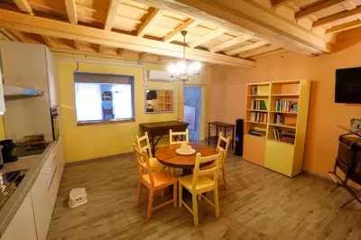 a kitchen and dining room with a table and chairs at Rome old town luxury loft in Rome