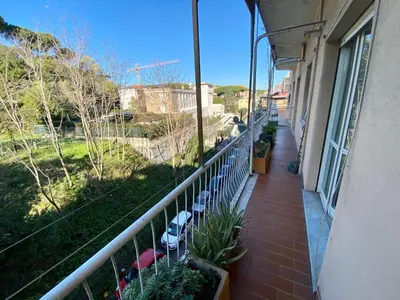 a balcony of a building with chairs and plants at Casa Alberto in Rome
