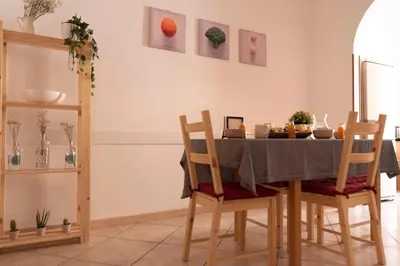 a dining room with a table and chairs at The Good Place B&B in Rome