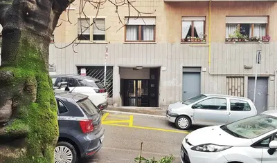 a group of cars parked in front of a building at STEFY ROME APARTMENT in Rome