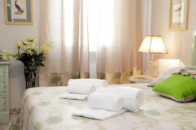 a bedroom with white towels on a bed at Restart Accommodations Rome in Rome