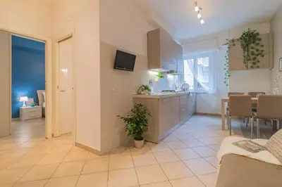 a living room with a kitchen and a dining room at Vaticano San Pietro Apartment in Rome