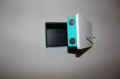a switch on a wall with a green and white box at condottieri al pigneto in Rome