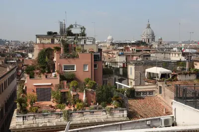 a view of a city from the roof of a building at Apartment Spanish Steps with panoramic roof-terrace in Rome
