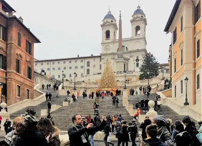 a group of people standing on stairs in front of a building at Apartment Spanish Steps with panoramic roof-terrace in Rome