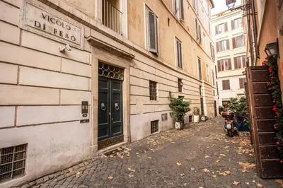 an alley with a building with a door on it at Febo Decharm apartment in Rome