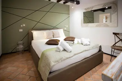 a bedroom with a bed with towels on it at Sofia alla VII Coorte in Rome