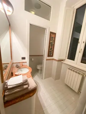 a bathroom with a sink and a toilet at OB1 Vacanze Romane in Rome